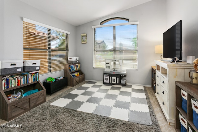 4704 E Melinda Ln, Phoenix, AZ 85050 - living area featuring vaulted ceiling and baseboards