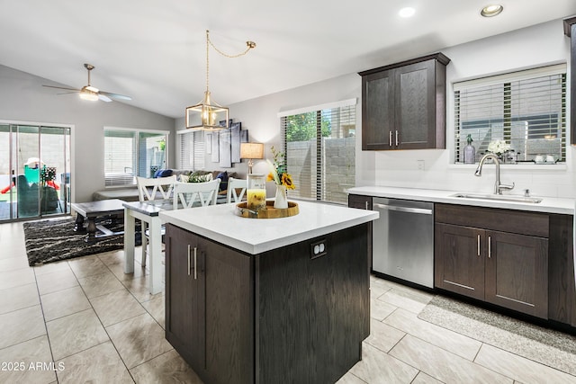 4704 E Melinda Ln, Phoenix, AZ 85050 - kitchen with stainless steel dishwasher, a sink, a ceiling fan, light countertops, and vaulted ceiling