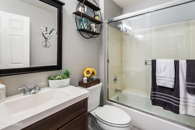 4704 E Melinda Ln, Phoenix, AZ 85050 - bathroom featuring vanity, toilet, and bath / shower combo with glass door