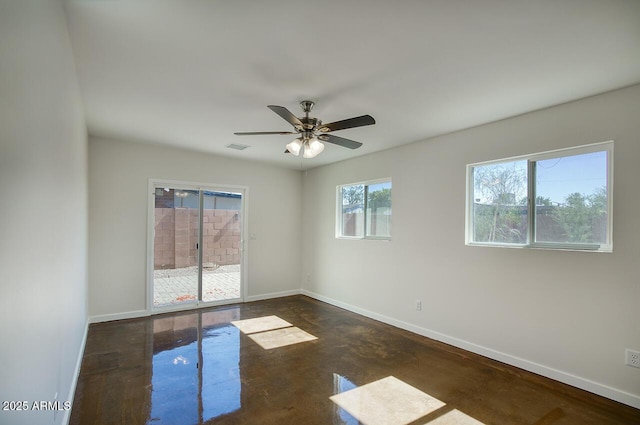 3841 N 21st Ave, Phoenix, AZ 85015 - spare room with baseboards and a ceiling fan