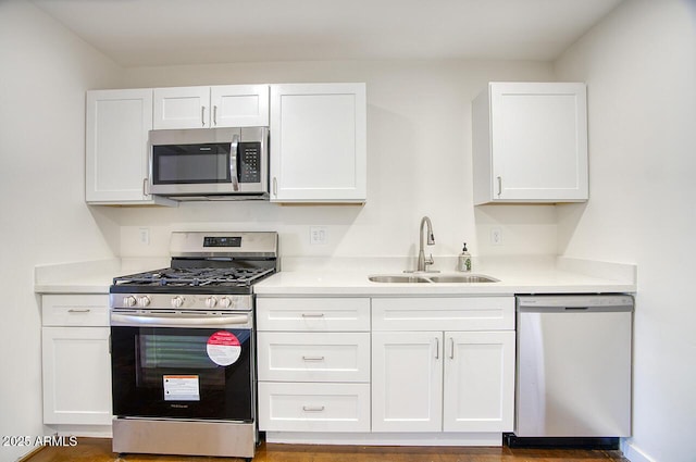3841 N 21st Ave, Phoenix, AZ 85015 - kitchen with appliances with stainless steel finishes, a sink, white cabinets, and light countertops