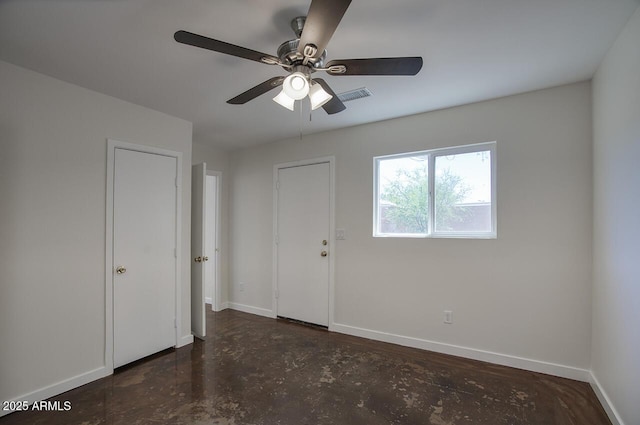 3841 N 21st Ave, Phoenix, AZ 85015 - spare room featuring baseboards, a ceiling fan, and concrete flooring