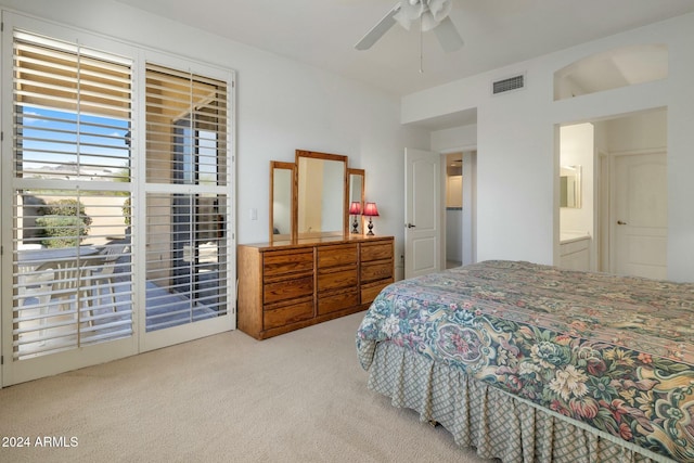 carpeted bedroom with access to outside, ensuite bath, and ceiling fan