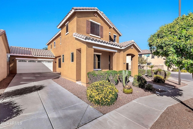 mediterranean / spanish-style house featuring a garage