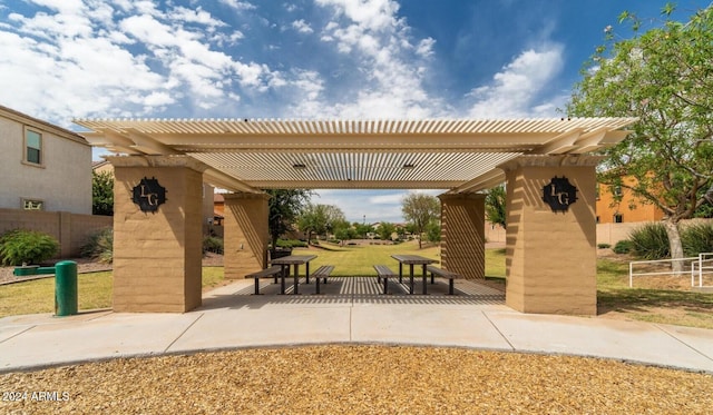 surrounding community featuring a pergola and a patio