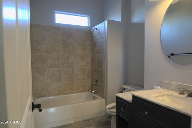 full bathroom with vanity, toilet, and tiled shower / bath