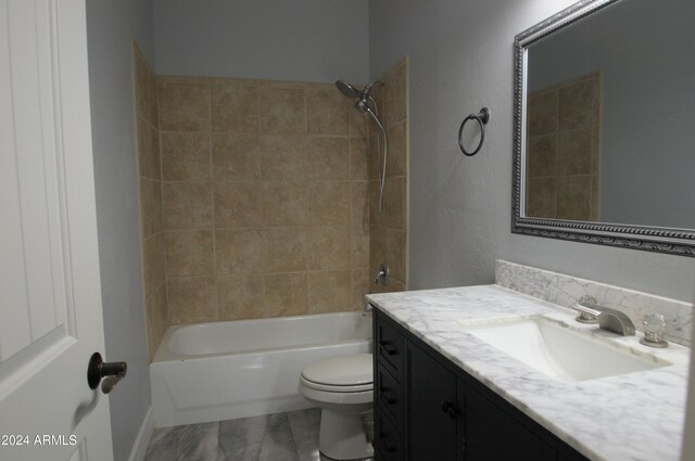 full bathroom with vanity, toilet, and tiled shower / bath