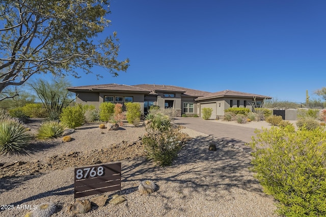 8768 E Granite Pass Rd, Scottsdale, AZ 85266 - prairie-style house with driveway and stucco siding