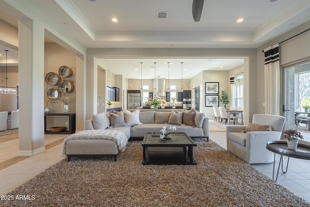 8768 E Granite Pass Rd, Scottsdale, AZ 85266 - living area featuring light tile patterned floors, a tray ceiling, a chandelier, and visible vents