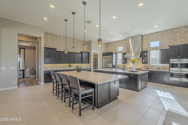 8768 E Granite Pass Rd, Scottsdale, AZ 85266 - kitchen with light countertops, a large island with sink, stainless steel appliances, backsplash, and extractor fan