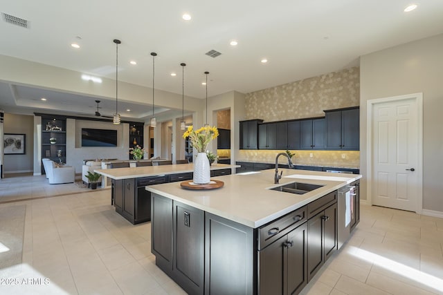 8768 E Granite Pass Rd, Scottsdale, AZ 85266 - kitchen with visible vents, a sink, a spacious island, and open floor plan