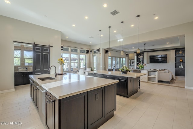 8768 E Granite Pass Rd, Scottsdale, AZ 85266 - kitchen featuring visible vents, a large island, a sink, and open floor plan