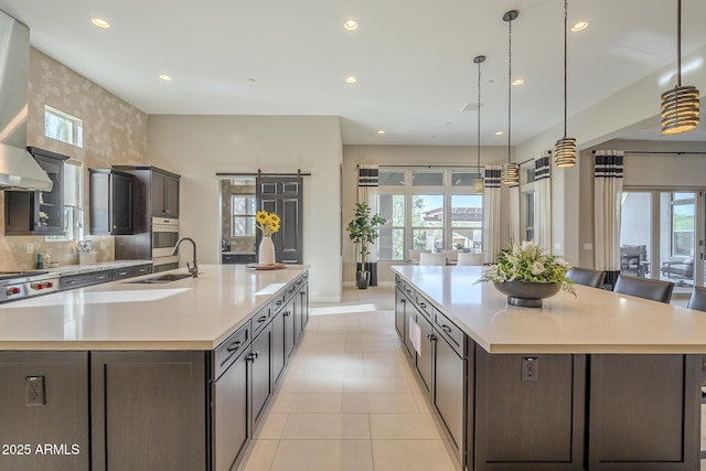 8768 E Granite Pass Rd, Scottsdale, AZ 85266 - kitchen featuring light countertops, a sink, and a spacious island