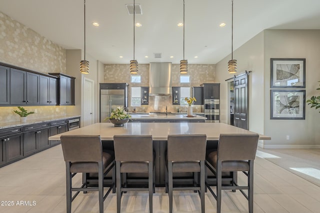 8768 E Granite Pass Rd, Scottsdale, AZ 85266 - kitchen featuring a kitchen bar, built in refrigerator, light tile patterned floors, a spacious island, and ventilation hood