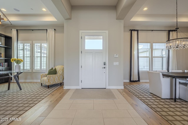 8768 E Granite Pass Rd, Scottsdale, AZ 85266 - entrance foyer featuring a chandelier, crown molding, hardwood / wood-style flooring, baseboards, and a tray ceiling