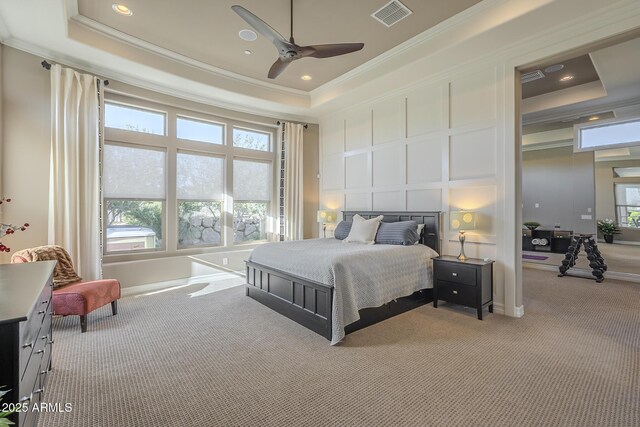 8768 E Granite Pass Rd, Scottsdale, AZ 85266 - bedroom featuring a tray ceiling, visible vents, and a decorative wall