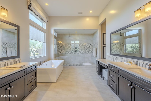 8768 E Granite Pass Rd, Scottsdale, AZ 85266 - bathroom featuring a freestanding bath, two vanities, a sink, and walk in shower