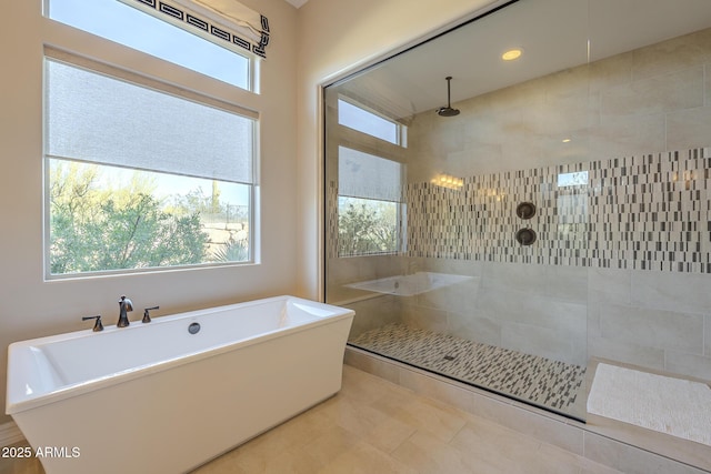 8768 E Granite Pass Rd, Scottsdale, AZ 85266 - full bath featuring a tile shower, a healthy amount of sunlight, and a freestanding bath