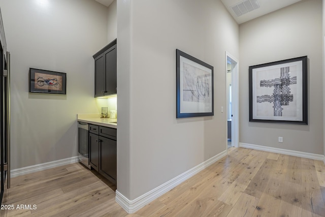 8768 E Granite Pass Rd, Scottsdale, AZ 85266 - hall featuring baseboards, visible vents, and light wood-style flooring