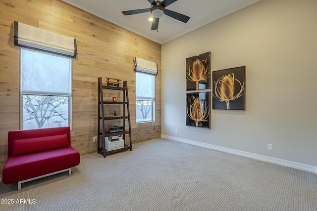 8768 E Granite Pass Rd, Scottsdale, AZ 85266 - sitting room featuring carpet flooring, wood walls, crown molding, baseboards, and a ceiling fan