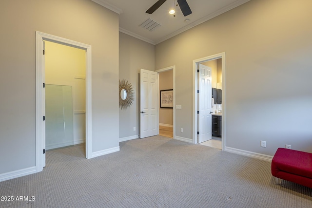 8768 E Granite Pass Rd, Scottsdale, AZ 85266 - unfurnished bedroom with visible vents, baseboards, ornamental molding, light carpet, and a spacious closet