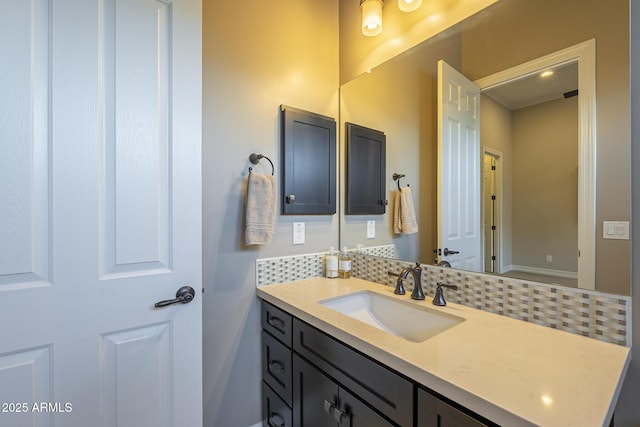 8768 E Granite Pass Rd, Scottsdale, AZ 85266 - bathroom featuring decorative backsplash, baseboards, and vanity