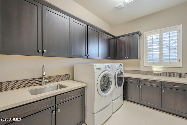 8768 E Granite Pass Rd, Scottsdale, AZ 85266 - laundry area featuring washing machine and dryer, cabinet space, and a sink
