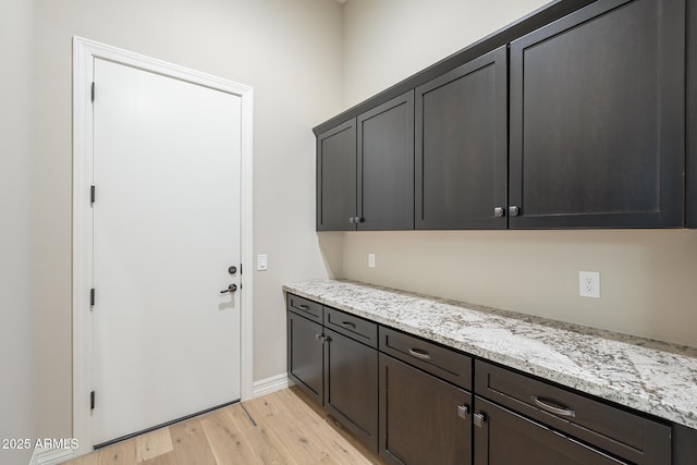 8768 E Granite Pass Rd, Scottsdale, AZ 85266 - laundry area with light wood-style floors