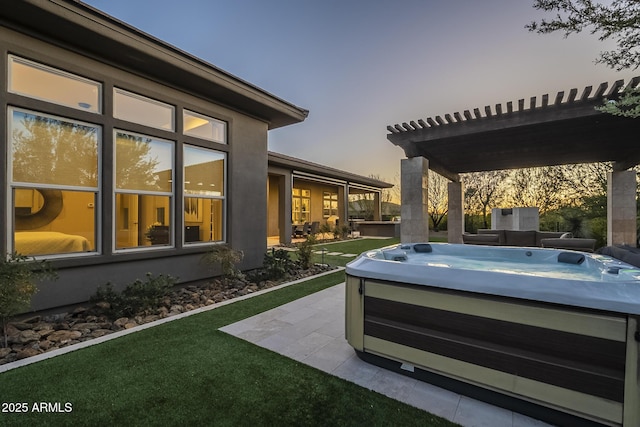 8768 E Granite Pass Rd, Scottsdale, AZ 85266 - yard at dusk featuring a pergola, a hot tub, and a patio area
