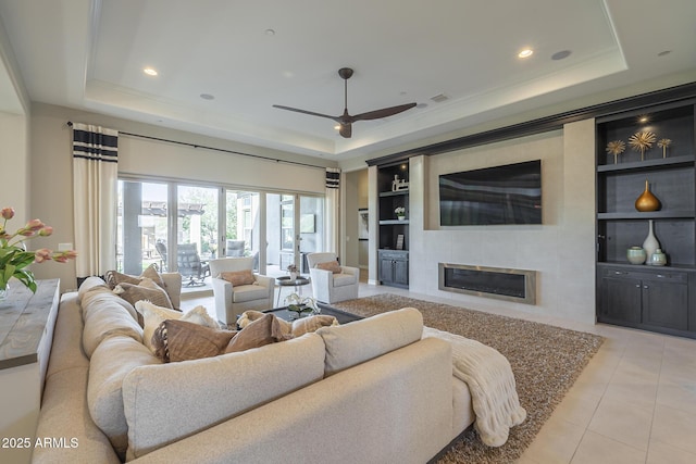 8768 E Granite Pass Rd, Scottsdale, AZ 85266 - living area with a ceiling fan, built in shelves, light tile patterned floors, and a raised ceiling