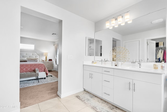 bathroom with vanity and tile patterned flooring