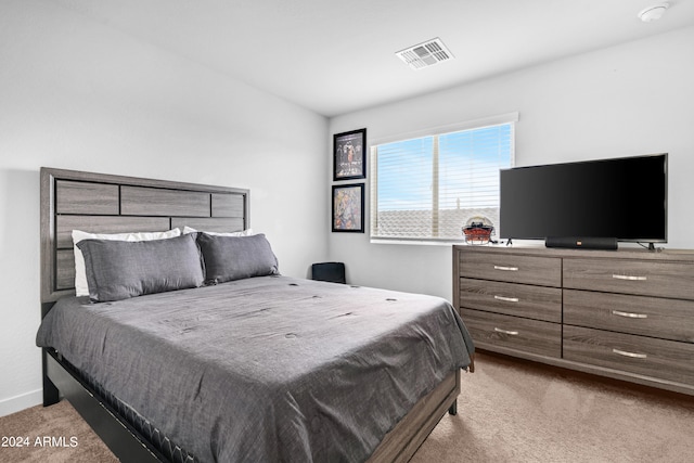 bedroom with light colored carpet