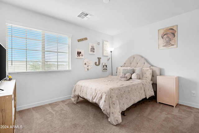 bedroom with light carpet