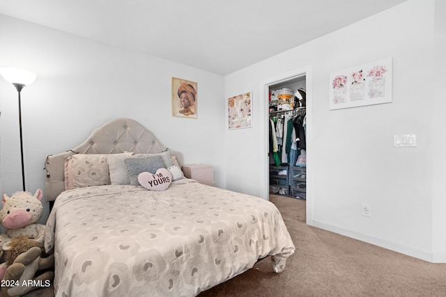 bedroom featuring a closet, carpet, and a spacious closet