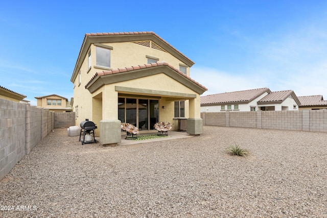 rear view of house featuring a patio area