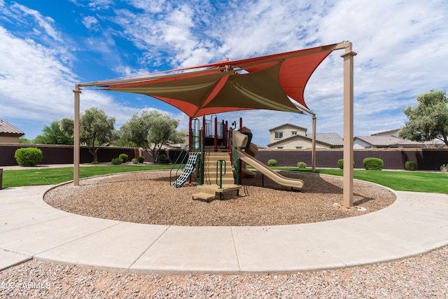 view of playground featuring a lawn