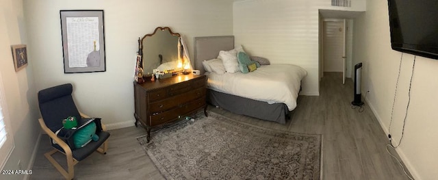 bedroom featuring hardwood / wood-style flooring