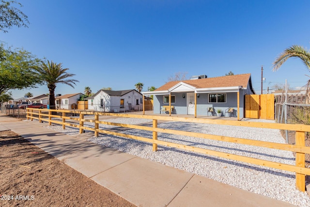 view of front of property featuring a fenced front yard and a residential view