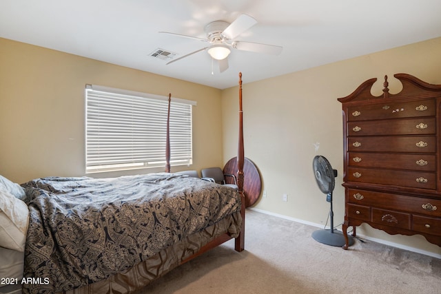 bedroom with light carpet and ceiling fan