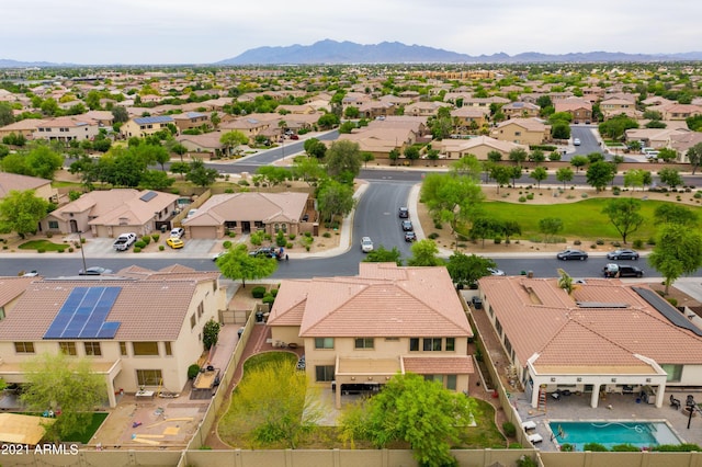 birds eye view of property with a mountain view