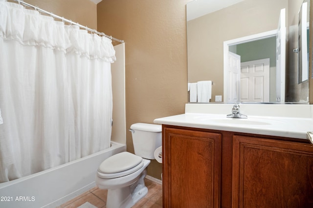 full bathroom featuring tile patterned flooring, vanity, toilet, and shower / bath combo with shower curtain