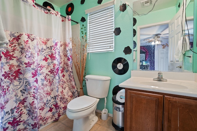 bathroom featuring tile patterned floors, vanity, ceiling fan, toilet, and curtained shower