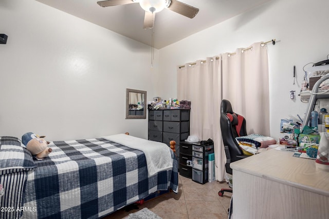 tiled bedroom featuring ceiling fan