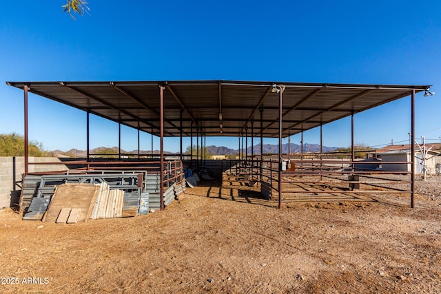 view of horse barn featuring a mountain view