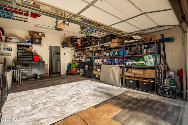 garage featuring a garage door opener