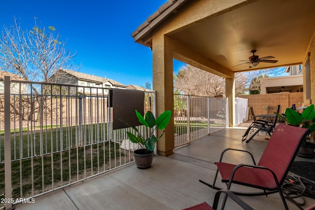 view of patio / terrace featuring ceiling fan