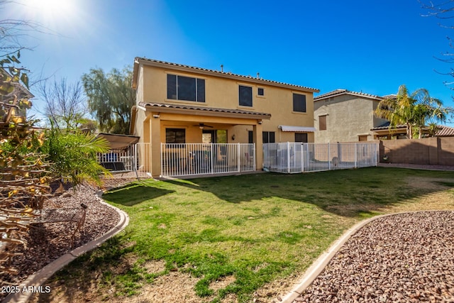 rear view of property with a yard