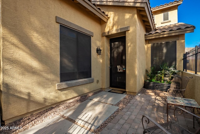 property entrance with a patio area