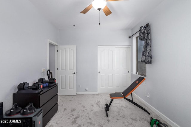 interior space featuring light colored carpet and ceiling fan