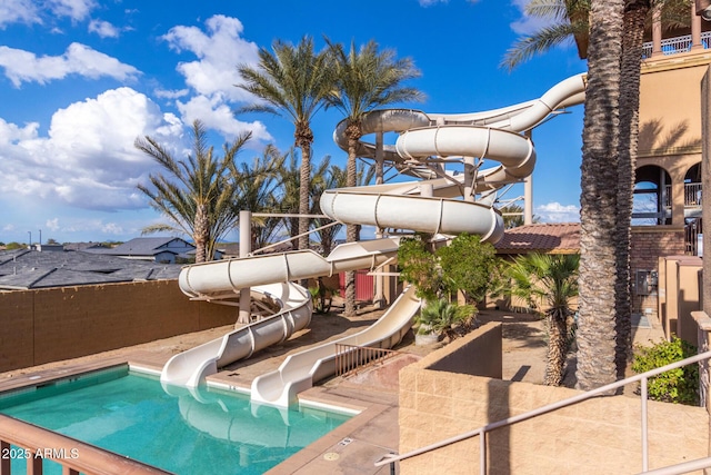 view of pool with a water slide